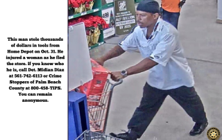 Black man in white shirt pushing shopping cart at Home Depot