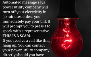 scam alert notice of text next a red light bulb that is on.