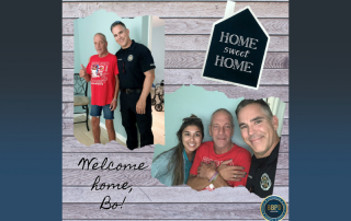 police officer with man and police officer with woman and man with sign that says home sweet home